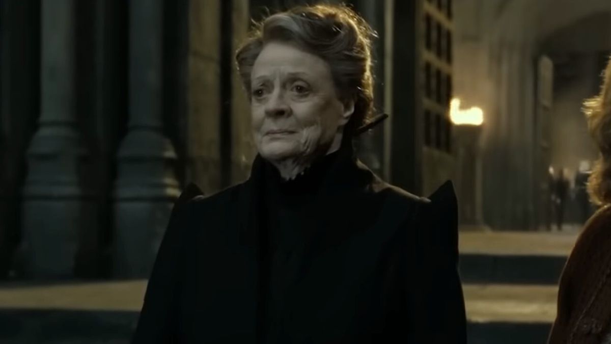 Dame Maggie Smith stands outside at night, with a grim look on her face in Harry Potter and the Deathly Hallows - Part 2.