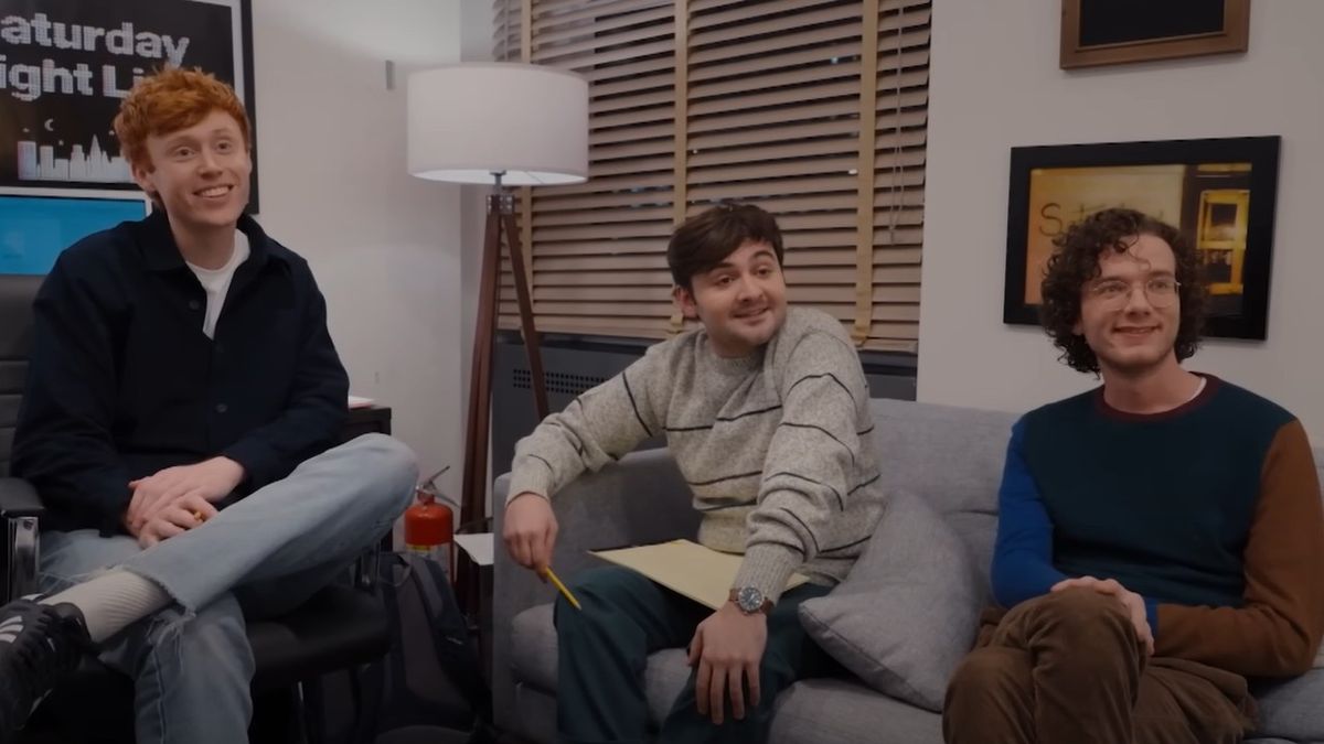 From left to right: Ben Marshall, John Higgins and Martin Herlihy smiling while sitting in their office on SNL.