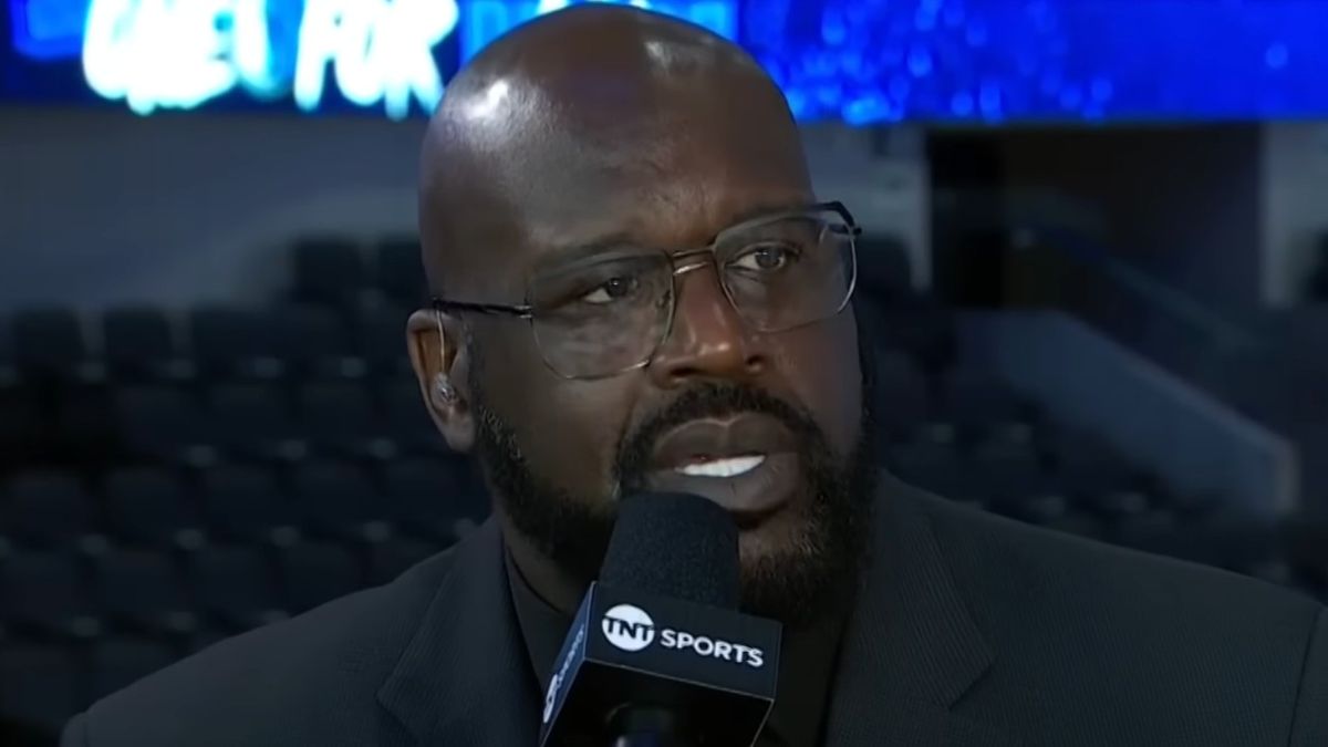 Shaquille O&#039;Neal talking about the NBA with a microphone in his hands