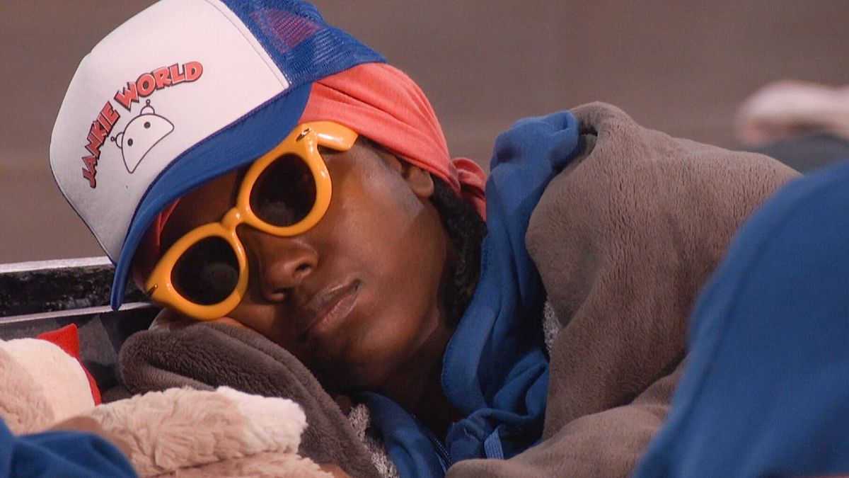 T&#039;Kor sleeping with sunglasses in the Big Brother house. 