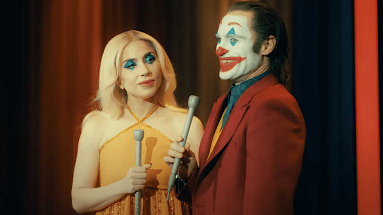 Harley Quinn (Lady Gaga) and Arthur Fleck (Joaquin Phoenix) prepare to entertain a crowd in Joker: Folie À Deux trailer