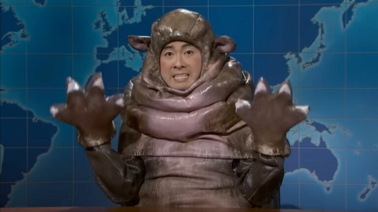 Bowen Yang dressed as Moo Deng the viral hippo on SNL's Weekend Update 